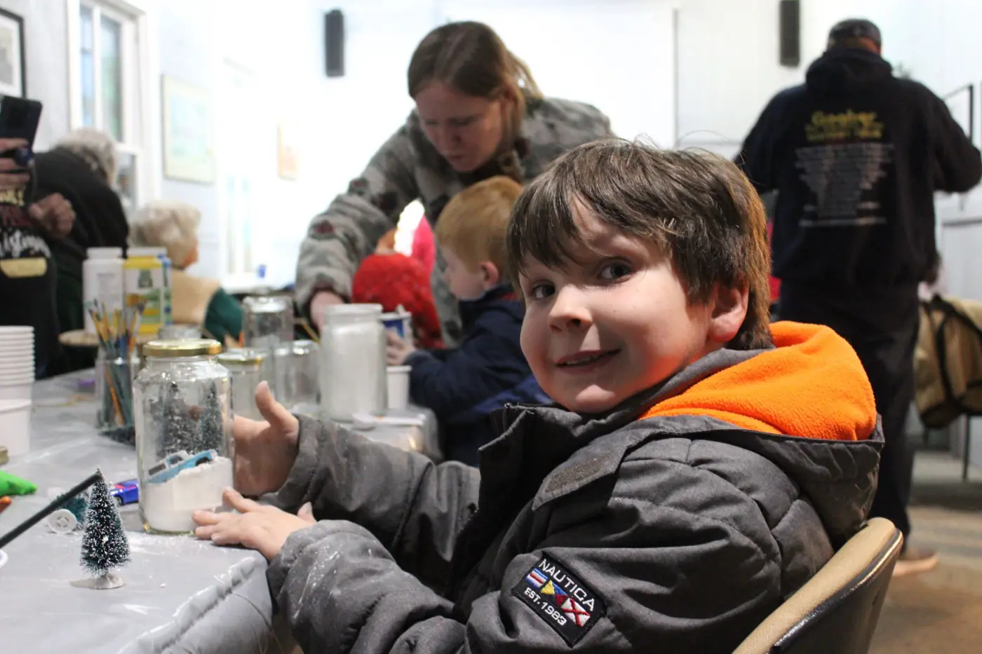 Families making crafts at Christmas at the Museum